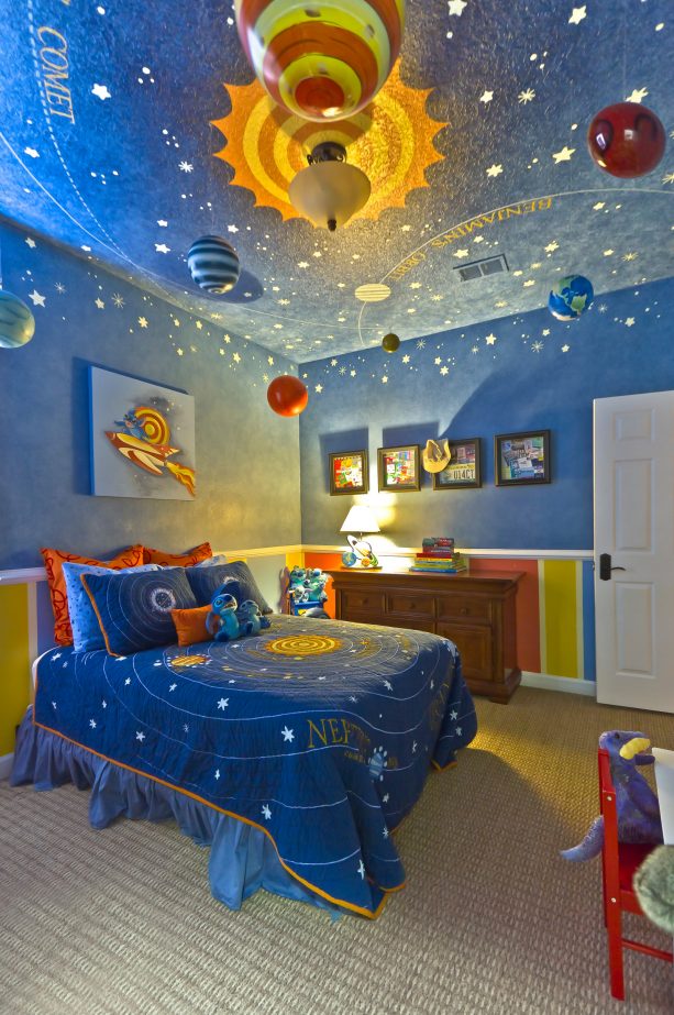 a stellar contemporary bedroom that lets you explore the solar system centering on a yellow and orange sun in the middle of a sky of blue walls and ceiling