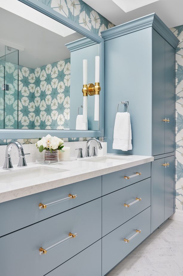 blue cabinets and a gray floor for a sleek mid-sized master bathroom