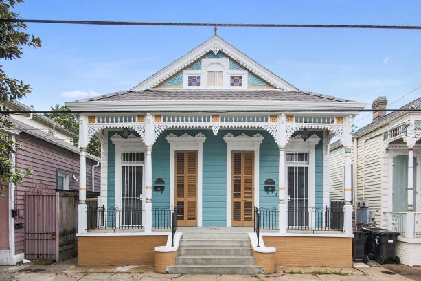 blue vinyl siding looks great on an eclectic one-story ranch style house