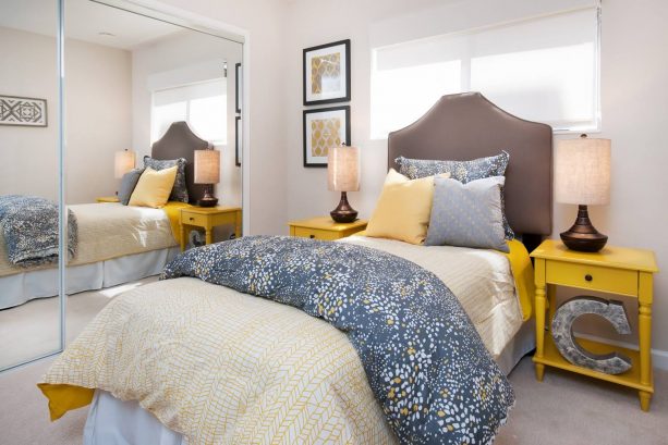 combine a blue-yellow comforter, a blue pillow, and sun porch bedside tables for a homey bedroom