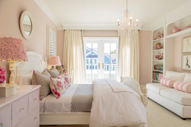 light pink walls and rosy lamp covers are perfect companions for a white bed