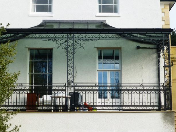 a classic porch should have classic-looking wrought iron columns