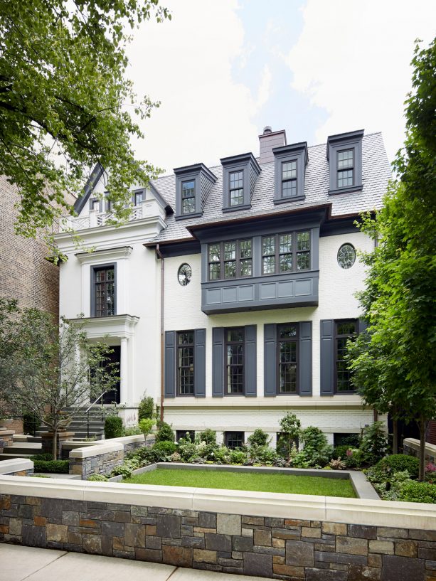 a white house with dark gray shutters looks so timeless