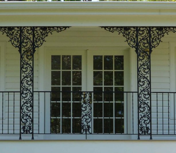 exquisite wrought iron columns suit the porch of a historic house perfectly