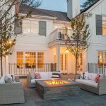 light gray shutters give a white house a modern appearance