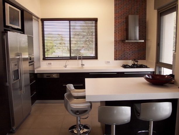 raised ranch kitchen remodel with small hood and a stovetop