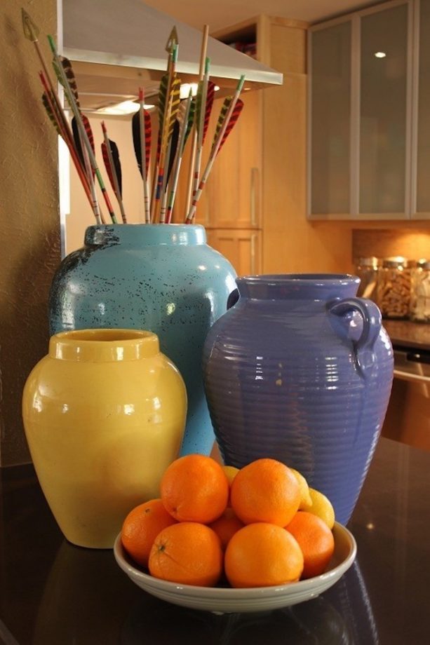 raised ranch kitchen with colorful oil jars