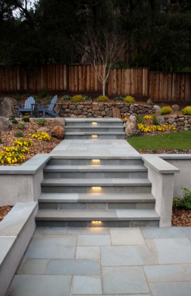 sleek stone veneer covering gives concrete steps a clean and fabulous look