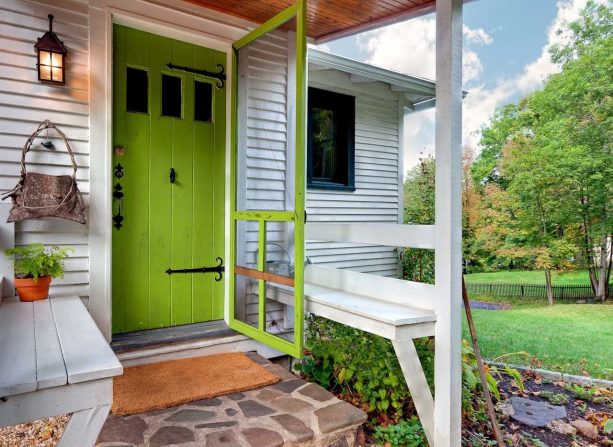 a lime green door makes a small entryway appear bigger