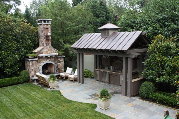 a standing seam metal patio cover with a gazebo at a timeless stone patio