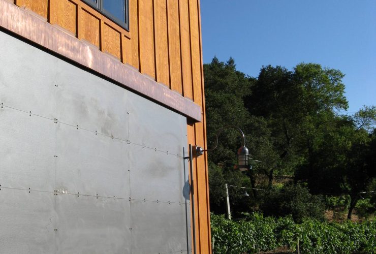 16 gauge sheet metal sliding barn doors as sturdy gates for an urban barn