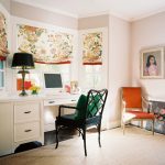 a white built-in wooden bay window desk paired with a black study chair