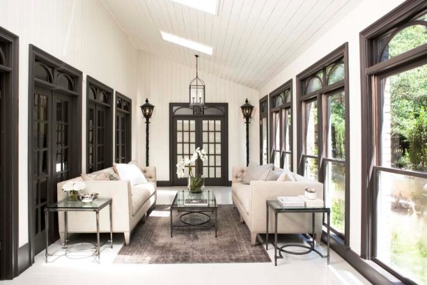 benjamin moore’s iron mountain trims darker than walls bathed in benjamin moore’s bavarian cream paint for a luxurious porch
