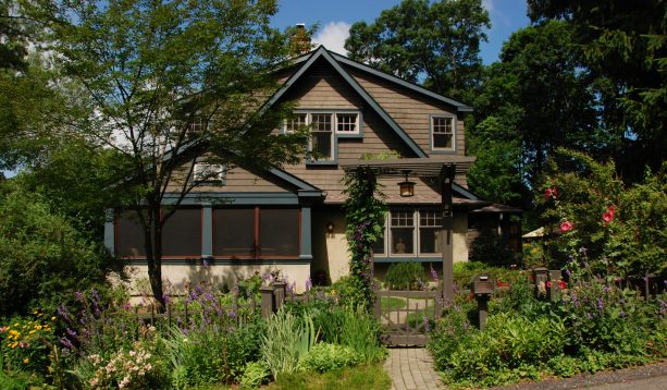 benjamin moore’s narragansett green trims darker than cabot semi solid deck burnt hickory cedar shingle on a sleek craftsman exterior