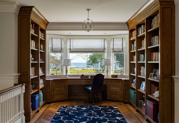 every large bay window would love to have a classic built-in medium tone wooden desk with lots of drawers