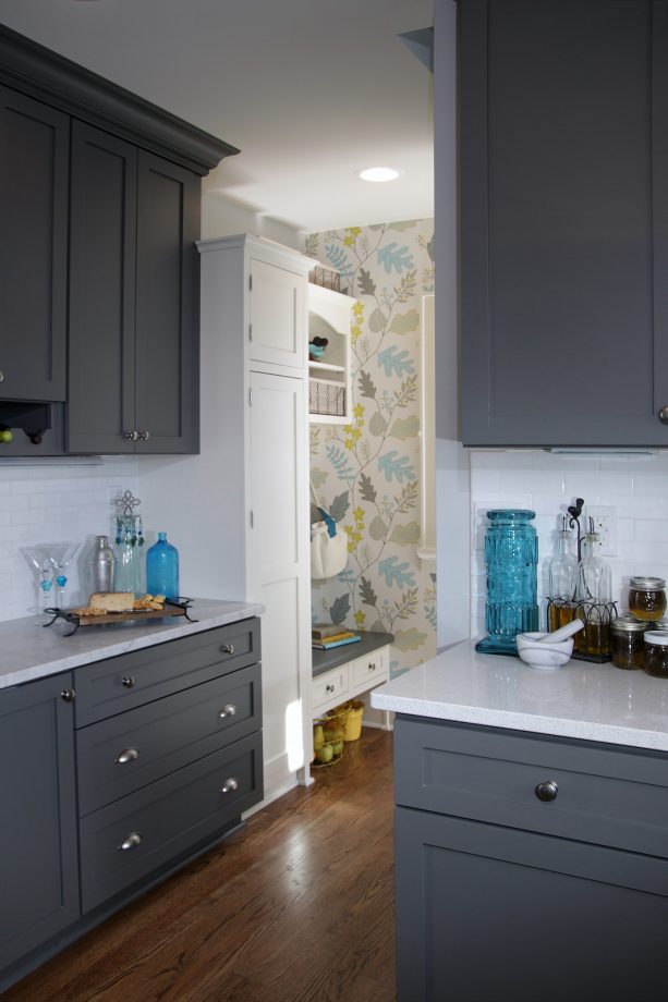 good things happen when gray and white cabinets meet teal accents in a kitchen that bridges the gap between the traditional and contemporary styles