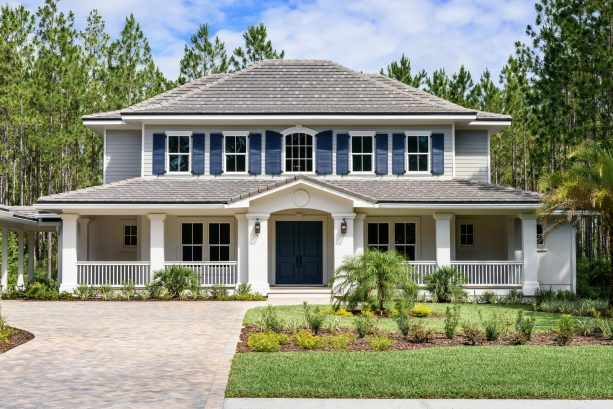 navy blue shutters in different sizes alongside the gray hip roof and shingle roof decorating a mixed siding house exterior