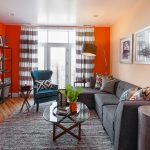 what one needs to create a stunning contemporary living room are orange walls and a big grey sectional sofa with a matching area rug