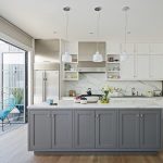 when classic white wall cabinetry meets soft gray island cabinets in an l-shaped transitional kitchen