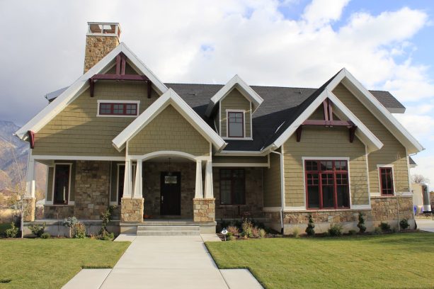 a green hardie gable front porch is perfect for a craftsman home
