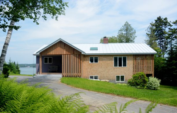 a raw wood gable front porch suits a simple ranch house