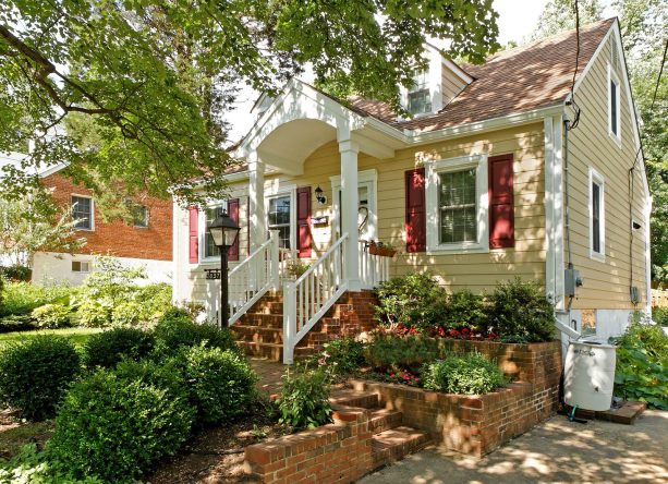 a white pvc gable front porch with autumn tan siding