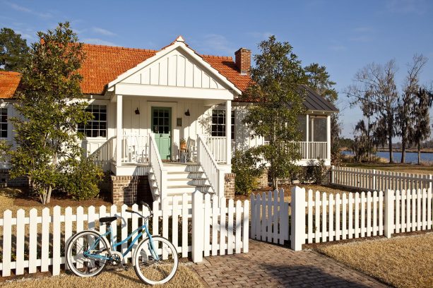 a white wood board and batten gable front porch is perfect for a small house