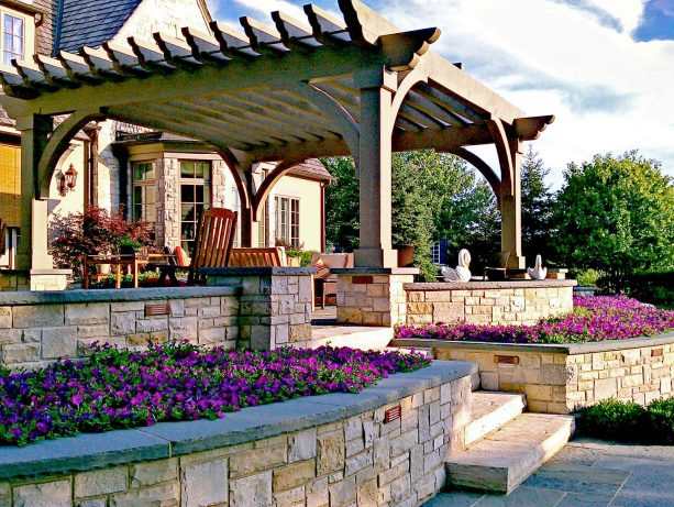 beige-colored stone veneered retaining and seat walls