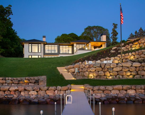 boulder rip rap retaining walls offering panoramic views of a lake