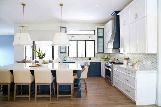 glass-front cabinets that combine navy and white are innovative additions any kitchen would love to get