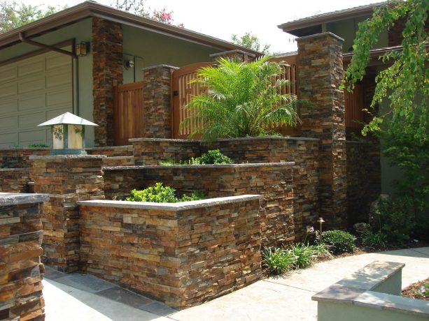 rustic brown slate stone veneer retaining wall in an asian-style landscape