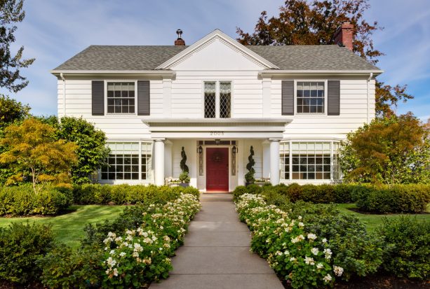 single hinged colonial front door painted in red