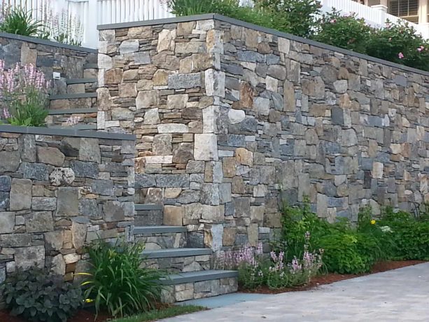 thin stone veneer retaining wall with bluestone cap