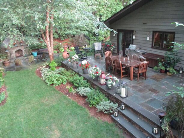 a dark gray raised patio paver offers a natural stone look that blends in seamlessly with nature
