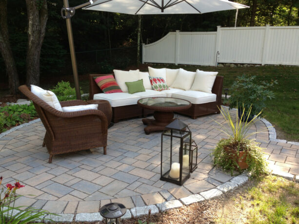 a fully furnished contemporary patio deserves to have a raised permeable stone paver with crushed stones underneath
