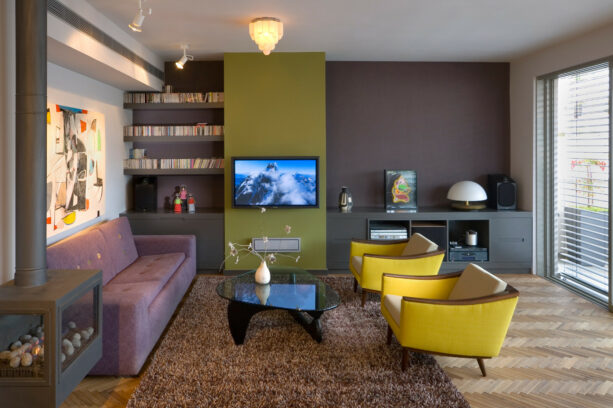 a green media wall in front of a purple one creates a harmonious combo of two accent walls