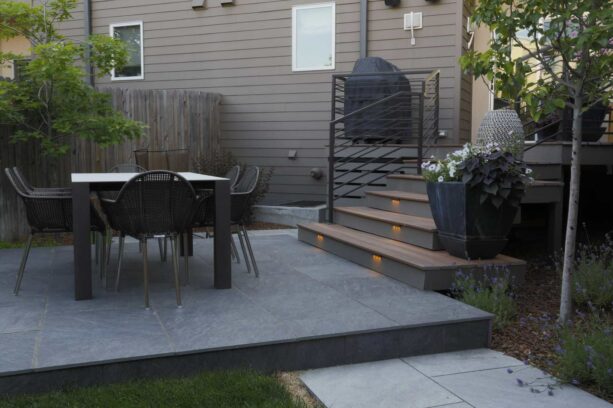 a porcelain paver offers an elegant look and cleaner properties than some other pavers to a raised patio