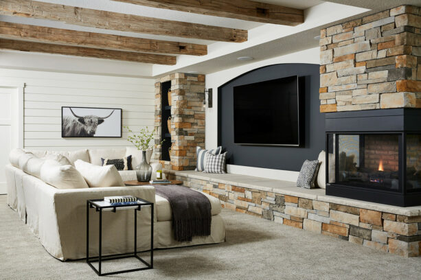 a small dark grey accent wall sandwiched by two protruding walls of stones