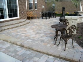 a unilock brussels block raised paver at an elegant traditional patio