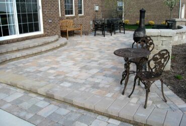 a unilock brussels block raised paver at an elegant traditional patio