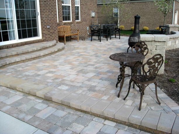 a unilock brussels block raised paver at an elegant traditional patio