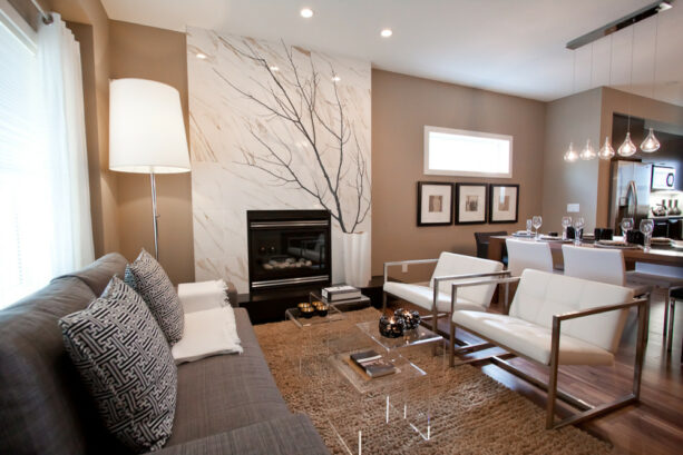 a white calcutta marble accent wall adds elegance to a medium brown living room
