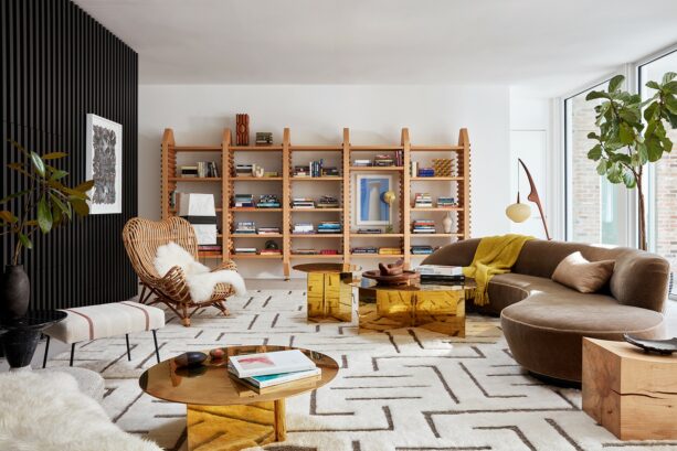 a white living room with attention-grabbing gold tables