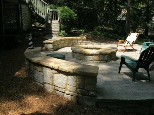 an interlocking concrete raised patio paver, and natural stacked stones are an amazing combination for an outdoor space