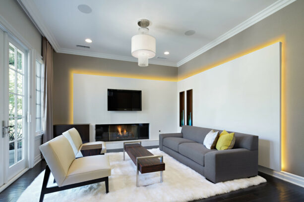 double drywall accent walls in white with golden glows shine in a grey living room