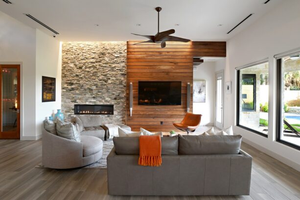 two stacked stone and wood accent walls bring life to a white living room
