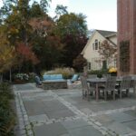 a bluestone paving with cobblestone edging idea for a well-integrated paver