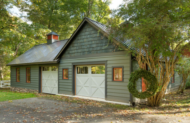 a dark green trim makes an excellent frame for a farmhouse garage door