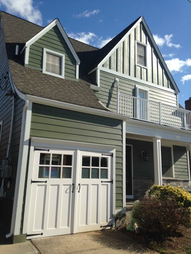 a james hardie fiber cement sage green siding makes a sturdy and cool traditional exterior