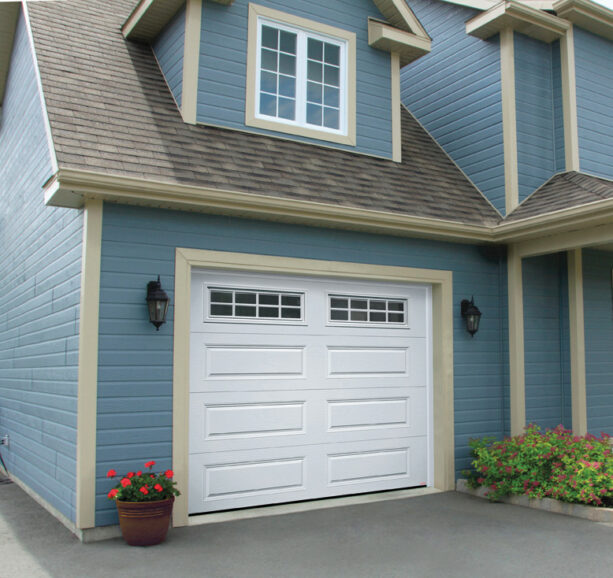 a mitered door trim on a light blue garage